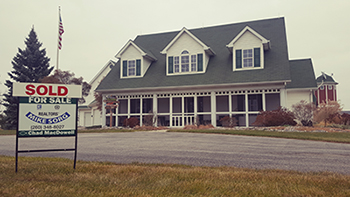 Sold Sign on House